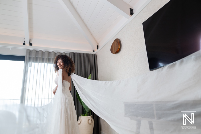 Bride preparing for wedding ceremony at Avila Beach Hotel in Curacao on a sunny day with beautiful views of the ocean
