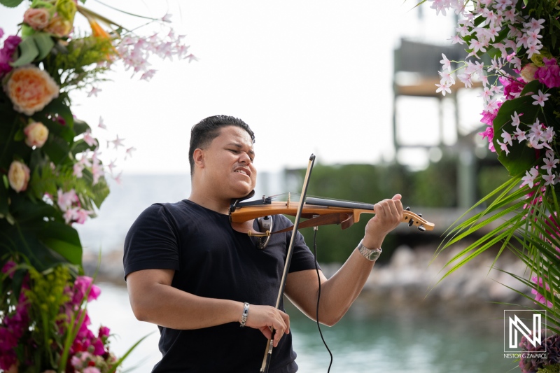 Violin player performing during a wedding ceremony at Avila Beach Hotel in Curacao