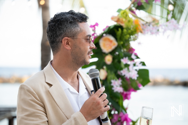 Wedding celebration at Avila Beach Hotel in Curacao with a speaker addressing the guests