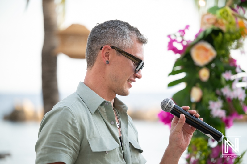 Memorable wedding ceremony at Avila Beach Hotel in Curacao with heartfelt speeches and beautiful decorations