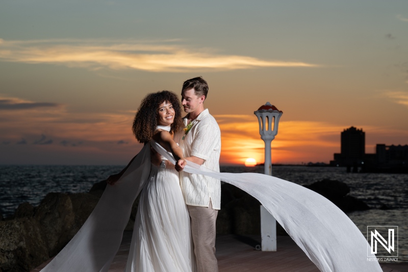 Wedding celebration at Avila Beach Hotel in Curacao with sunset views over the ocean