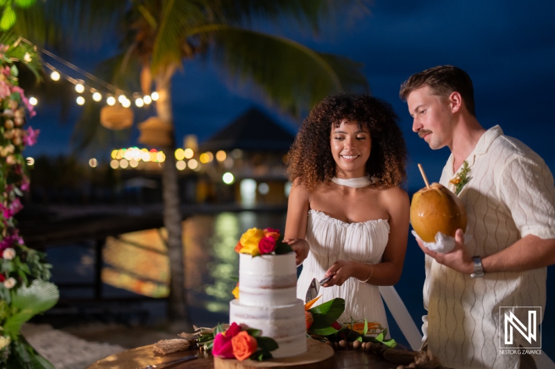 Wedding celebration at Avila Beach Hotel in Curacao featuring cake cutting and joy
