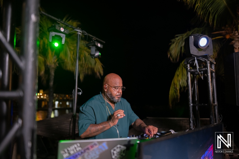 Event at Avila Beach Hotel in Curacao features DJ entertaining guests during a wedding celebration on the beach