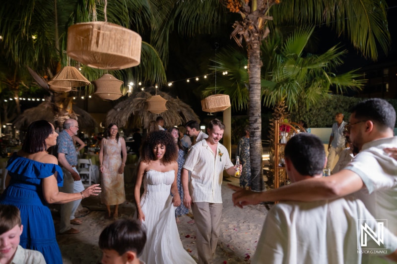 Wedding celebration at Avila Beach Hotel in Curacao brings together friends and family for a joyful evening on the beach