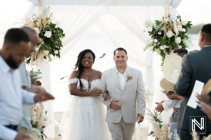 Bride and groom walking down the aisle