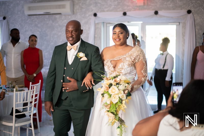 Bride and father walking down the isle