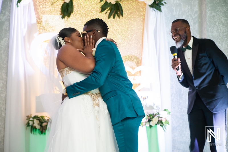 Bride and groom first kiss