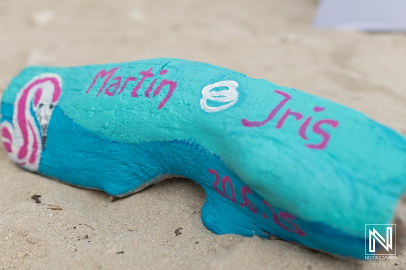 Ceremonial driftwood with names at Daaibooi Beach wedding in Curacao capturing love and elegance