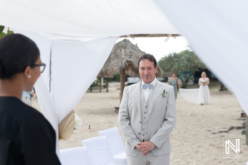 Destination wedding ceremony at Daaibooi Beach in Curacao celebrating love and joy in a beautiful tropical setting