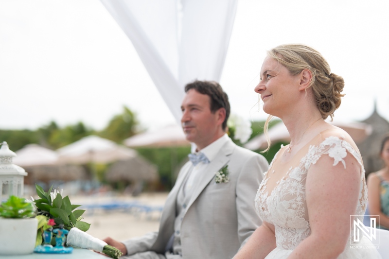 Celebration of love at Daaibooi Beach in Curacao during a beautiful destination wedding ceremony