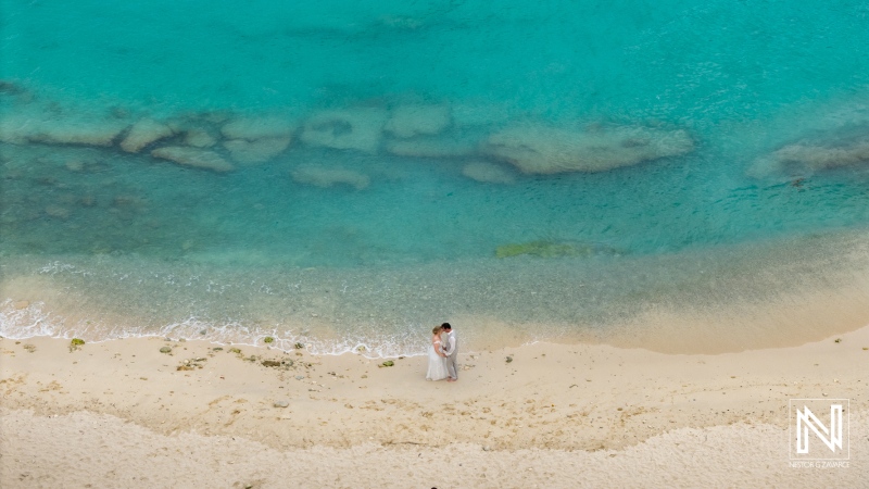 Destination wedding celebration at Daaibooi Beach in Curacao with stunning turquoise waters and sandy shores