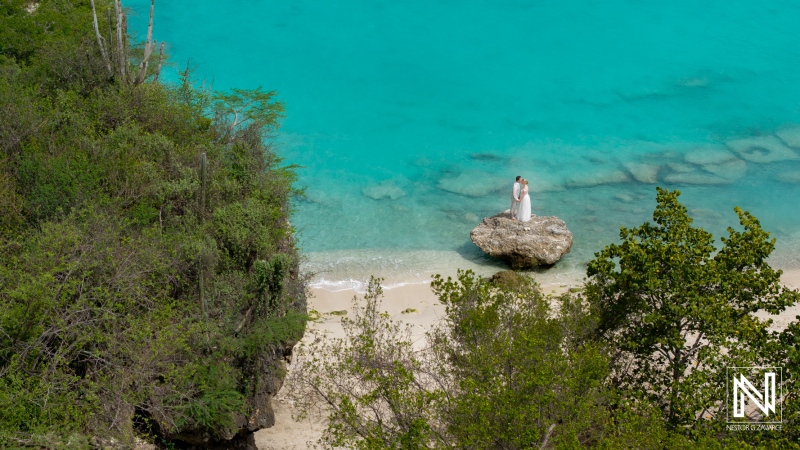 Wedding ceremony at Daaibooi Beach in Curacao with stunning turquoise waters and natural scenery