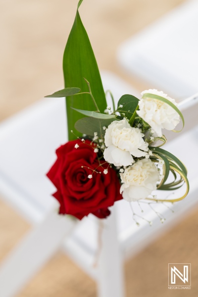 Beautiful floral arrangement at a wedding ceremony at Sunscape Curacao Resort showcasing elegant red and white blooms