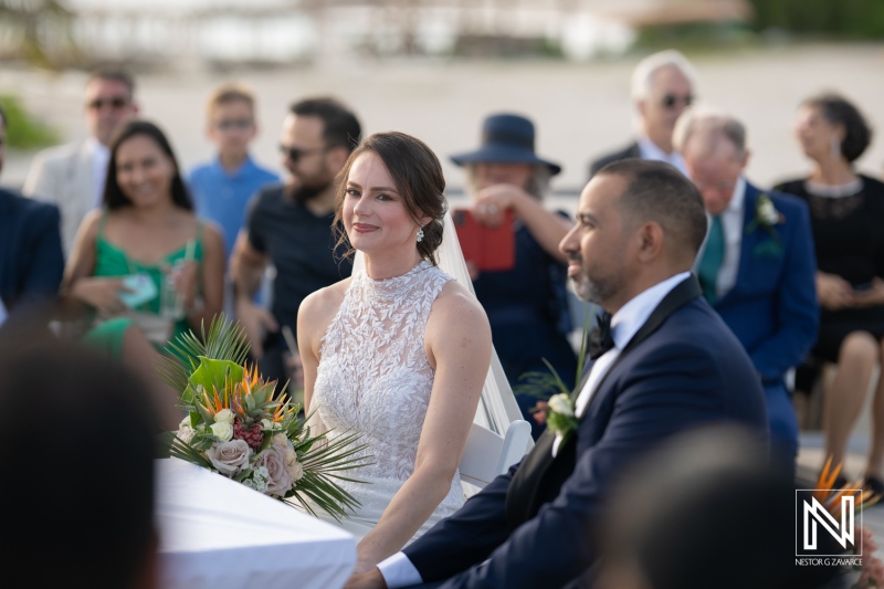 Beautiful wedding ceremony at sunset on the beach in Curacao Marriott Beach Resort creating unforgettable memories for the couple and their guests