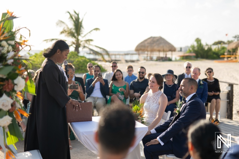 Celebration of love during sunset at a beach wedding ceremony in Curacao Marriott Beach Resort