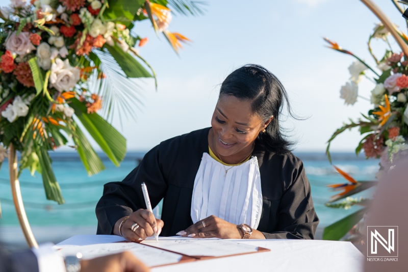 Ceremony celebrating love at sunset on the beach in Curacao near the beautiful Marriott Beach Resort