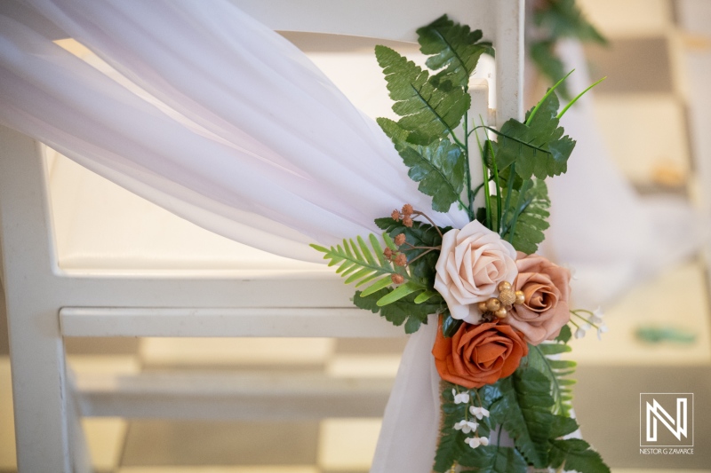 Wedding decor at Avila Beach Hotel in Curacao with floral arrangements and fabric details