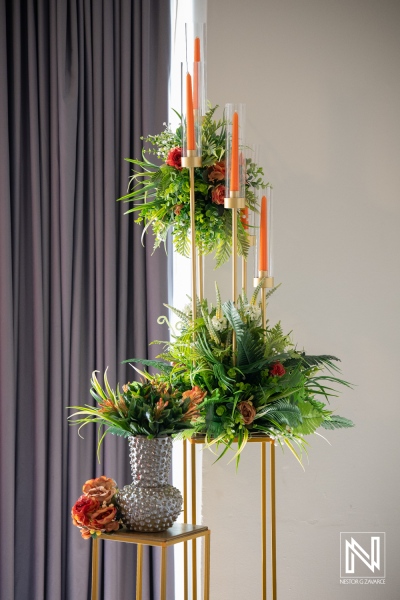 Wedding decor setup at Avila Beach Hotel in Curacao features floral arrangements and candles