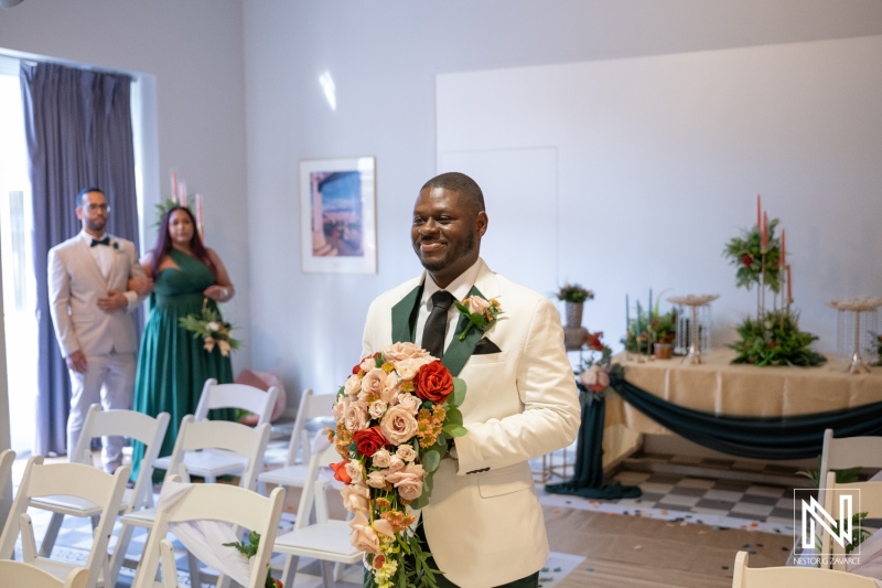 Wedding ceremony at Avila Beach Hotel in Curacao with people celebrating and witnessing the special moment