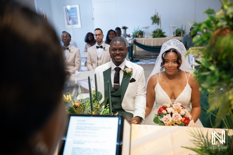 Wedding ceremony at Avila Beach Hotel in Curacao with couple and guests present