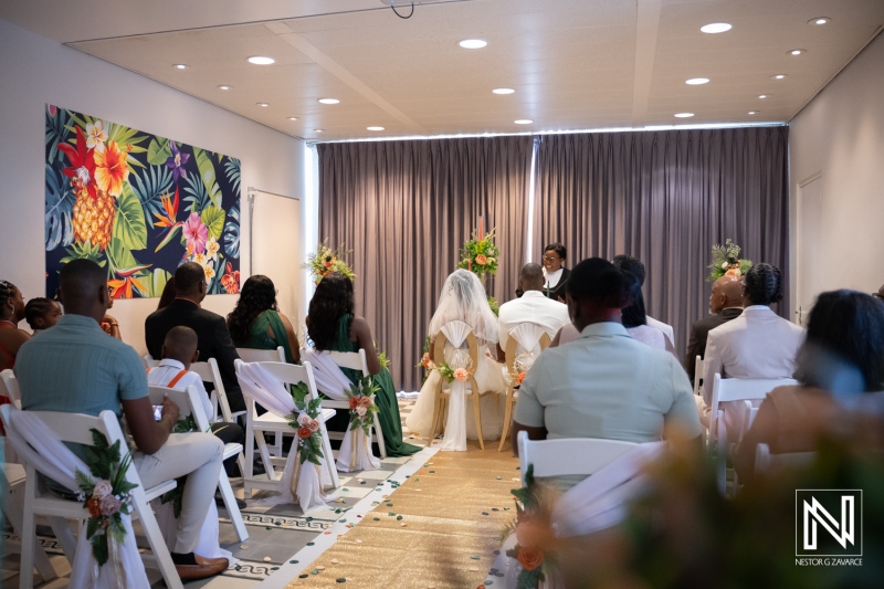 Wedding ceremony held at Avila Beach Hotel in Curacao with guests seated and couple in front
