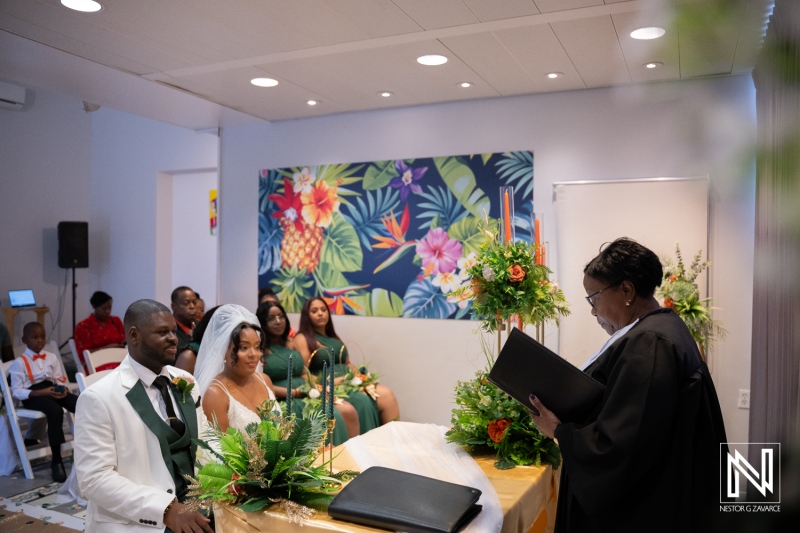 Wedding ceremony at Avila Beach Hotel in Curacao with happy couple and guests
