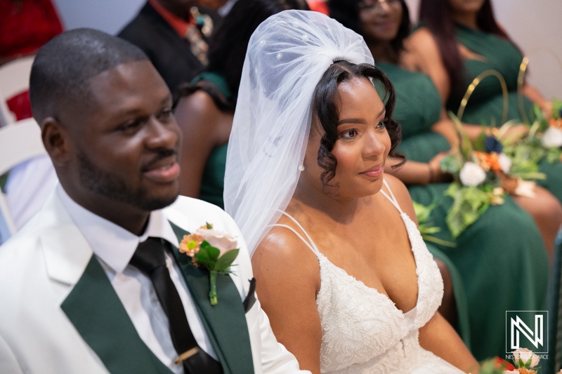 Wedding ceremony at Avila Beach Hotel in Curacao with couple and guests enjoying special moments
