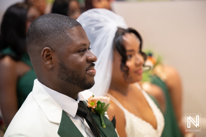 Wedding ceremony at Avila Beach Hotel in Curacao with a couple and guests present