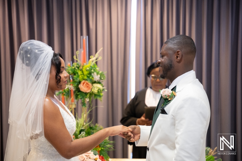 Wedding ceremony at Avila Beach Hotel in Curacao with couple exchanging vows