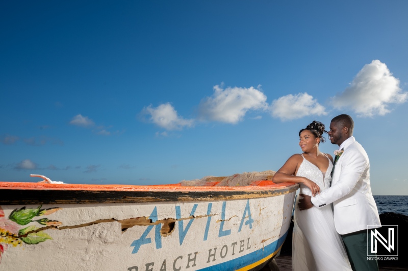 Couple celebrates wedding at Avila Beach Hotel in Curacao during a sunny day by the water