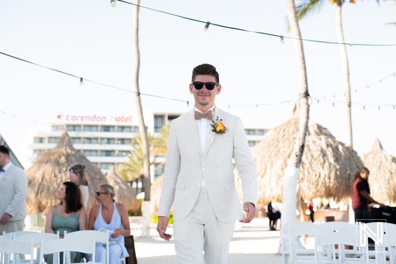 Groom walking down the aisle