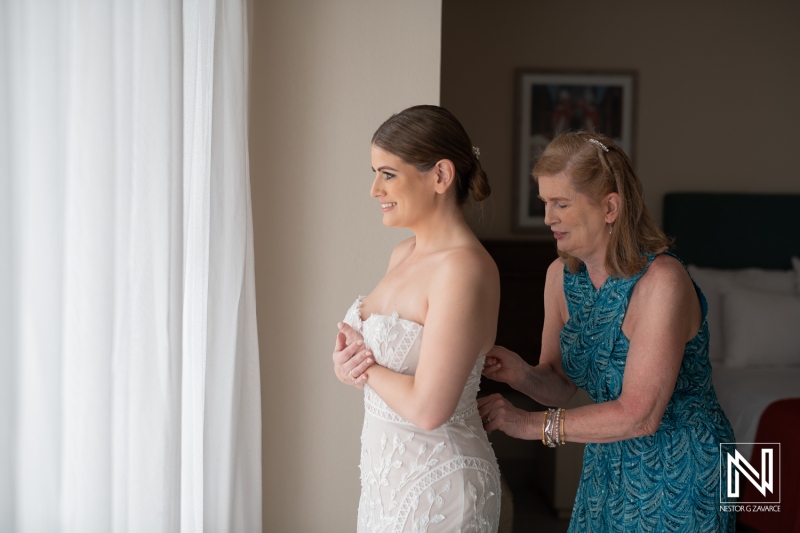Bride getting into attire