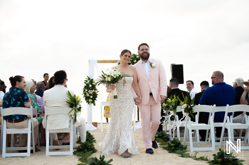 Bride and groom walking out the aisle