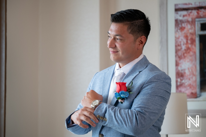 Groom prepares for wedding ceremony at Dreams Curacao Resort, Spa Casino with excitement and care
