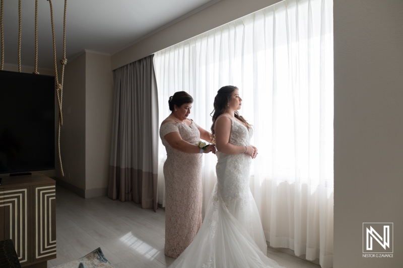 Bridal preparation at a wedding venue in Curacao with family support and a focus on the special moment