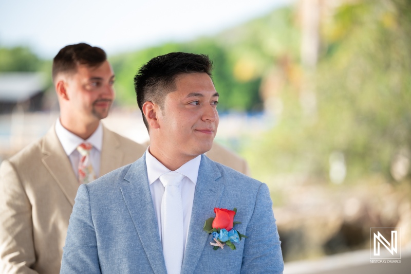 Wedding ceremony at Dreams Curacao Resort and Spa during sunny day with groom awaiting his bride