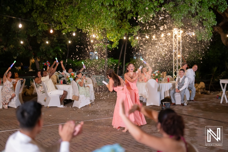 Guests celebrate and dance at a wedding held at Dreams Curacao Resort Spa Casino in Curacao during the evening