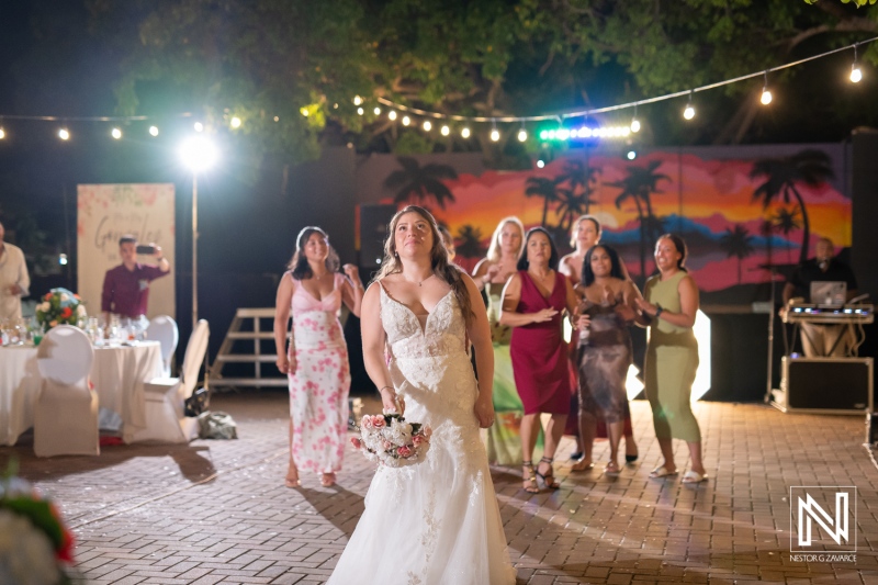 Wedding celebration at Dreams Curacao Resort with guests dancing and enjoying the event in the evening