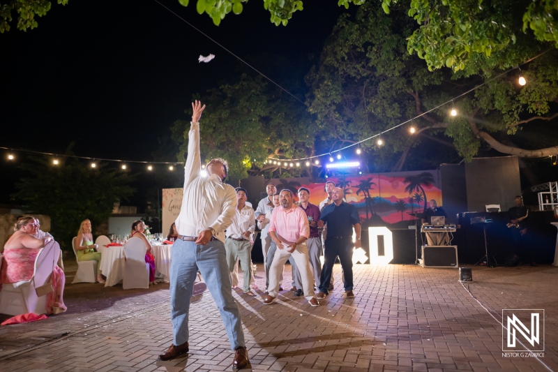 Guests celebrate at wedding event in Dreams Curacao Resort with lively activities and dancing under the night sky