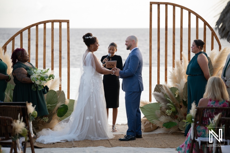 Wedding ceremony at Renaissance Wind Creek in Curacao by the beach at sunset