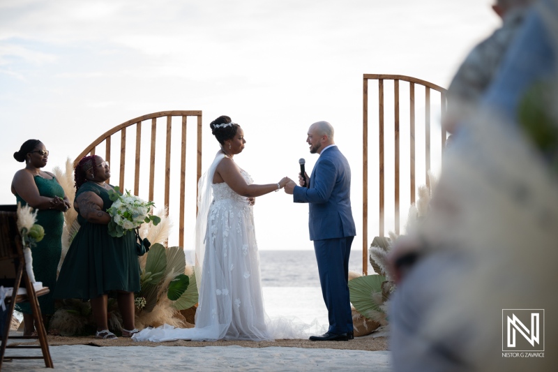 Wedding ceremony at Renaissance Wind Creek in Curacao on the beach with guests present