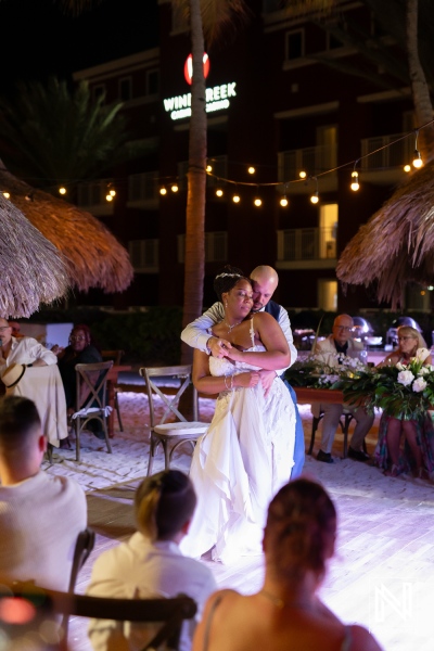 Couple dances together at their wedding reception at Renaissance Wind Creek in Curacao during the evening