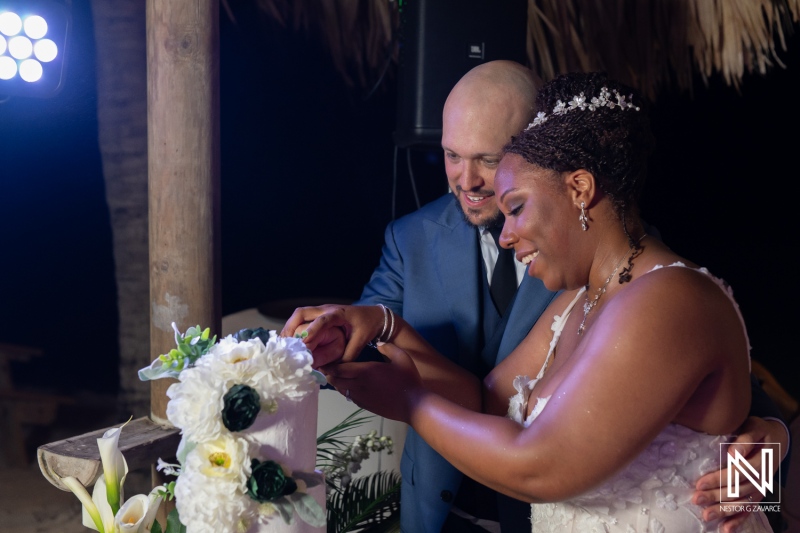 Wedding ceremony at Renaissance Wind Creek in Curacao with couple at altar