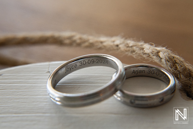 Symbolic wedding rings captured at Papagayo Beach Resort in Curacao, commemorating Joyce and Arjan's special day on September 30, 2023