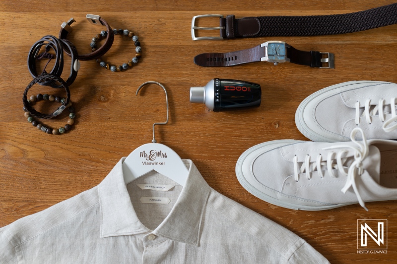 Wedding preparations featuring stylish attire and accessories at Papagayo Beach Resort, Curacao, captured during a sunny day