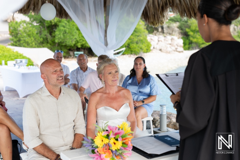 Romantic wedding ceremony at Karakter in Curacao with beautiful backdrop and happy couple