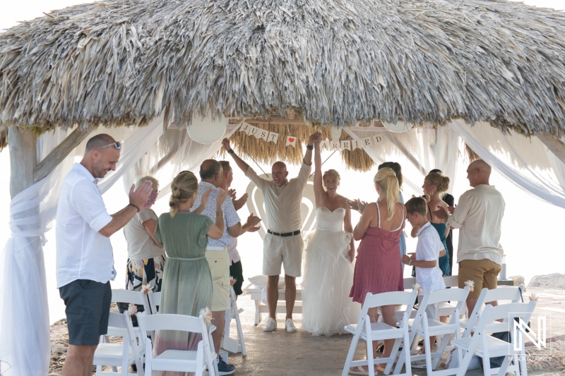 Celebration of a beautiful wedding ceremony at Karakter in Curacao with family and friends rejoicing together