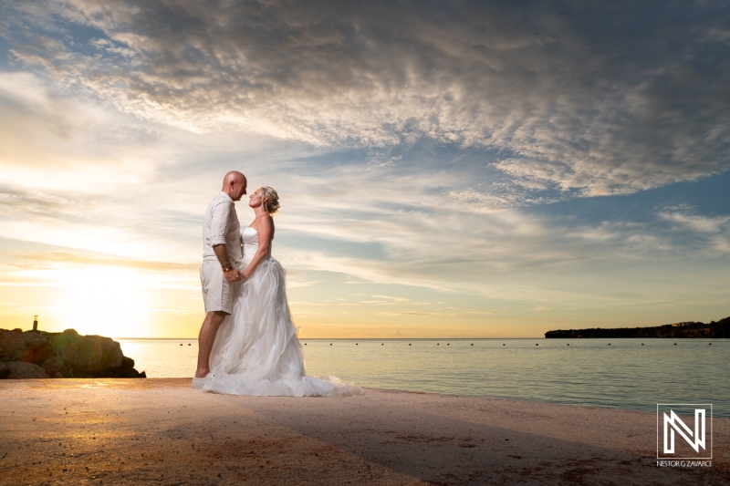 Beautiful sunset wedding moment in Curacao showcasing a couple's love at Karakter beach