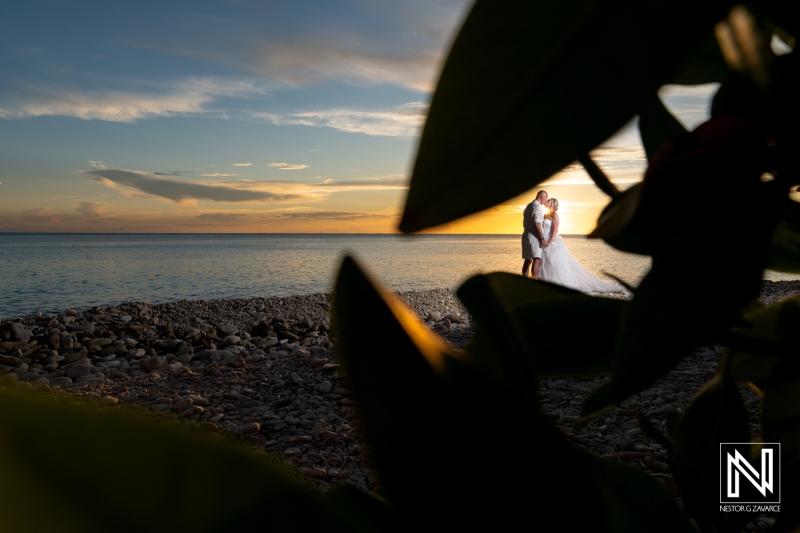 Beautiful sunset wedding ceremony at Karakter beach in Curacao showcasing joyful couple against a picturesque backdrop