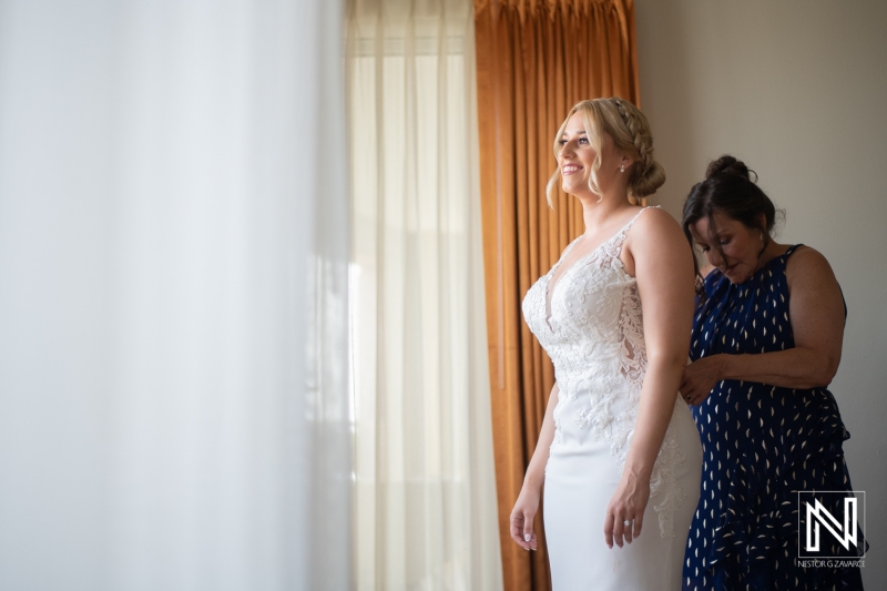 Bride getting into attire